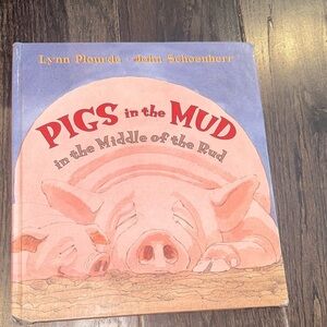 Pigs in the mud in the middle of the road kids book